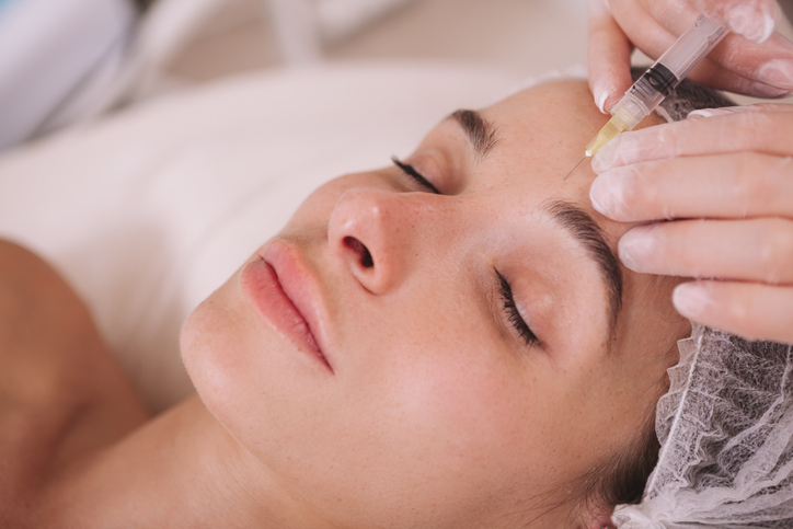 anti wrinkle injections in woman's forehead