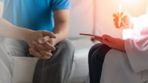 man discussing pearly penile papules with doctor